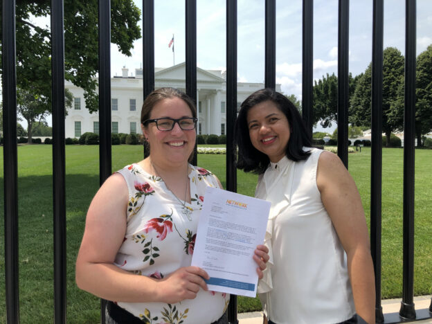 Emily and Ronnate with a letter - Title42