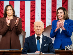 President Biden in front of a microphone
