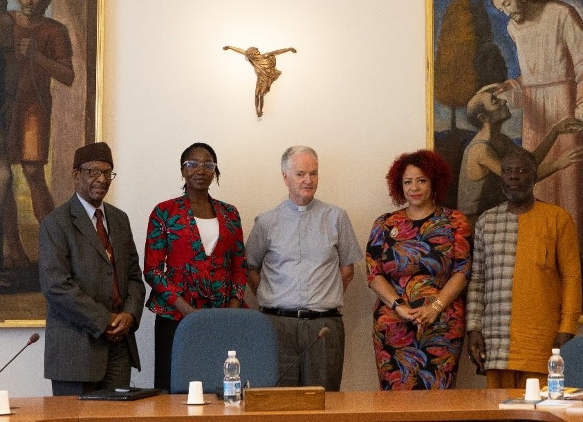 Dr. Ron Daniels, Amara Enyia, Bishop Paul Tighe, Nikole Hanna-Jones, and Kamm Howard meet at the Vatican's Dicastery for Culture and Education on July 18 to share ideas regarding reparations for Black people in the U.S.