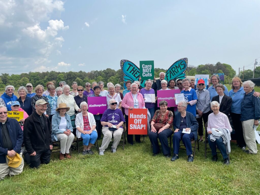 Justice-seekers gather at the Care Not Cuts rally in Long Island on May 22.
