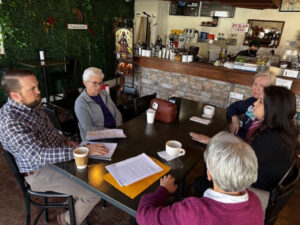 MO advocates sit around a table meeting with a member of Sen. Eric Schmitt's staff.
